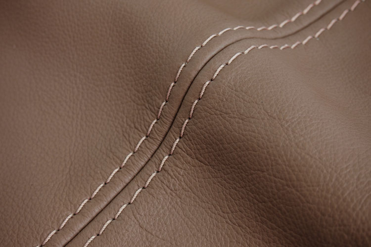 Lightly pigmented semi-aniline leather